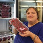 client holding raspberries